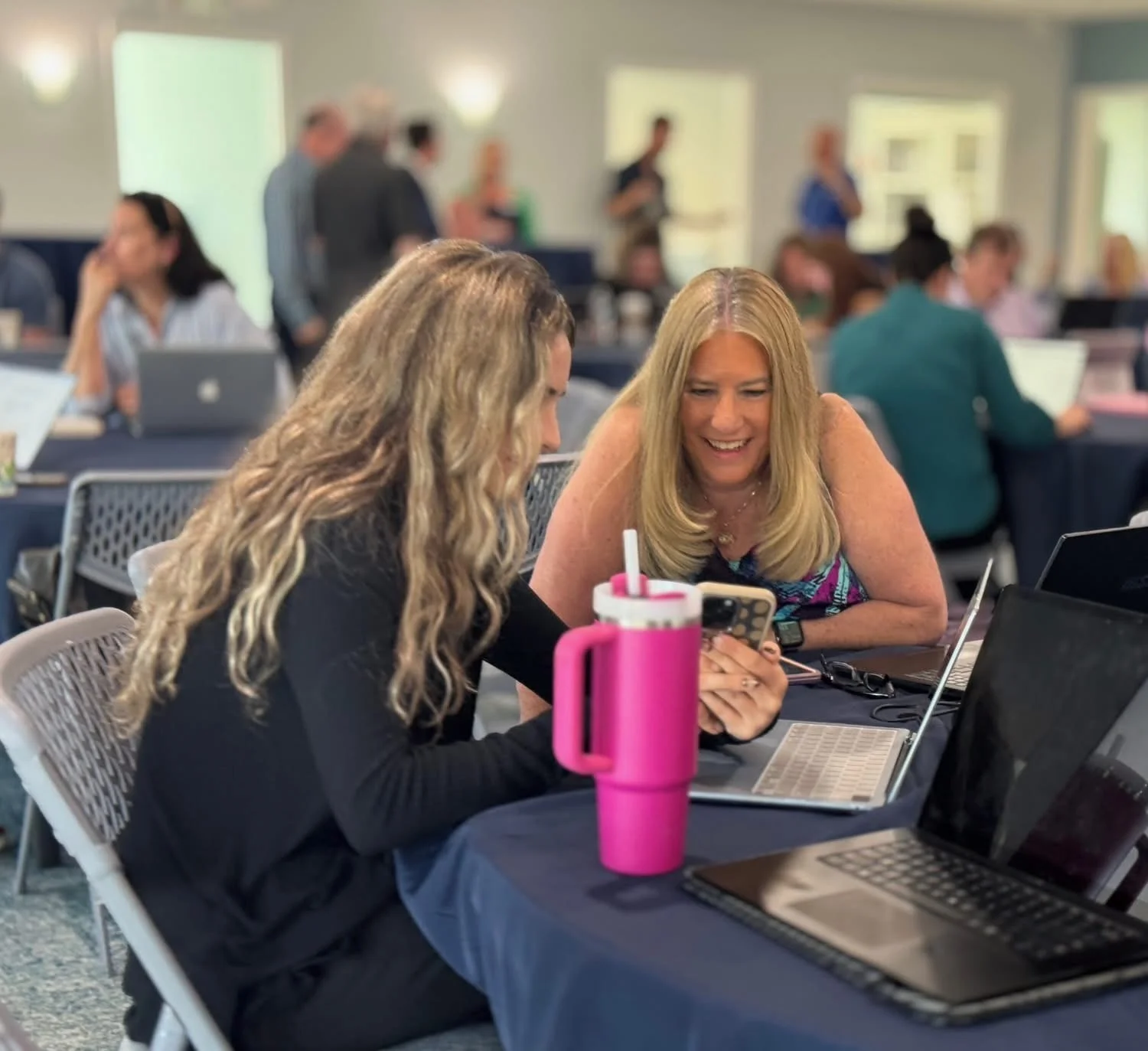 A student helping an attendee one on one