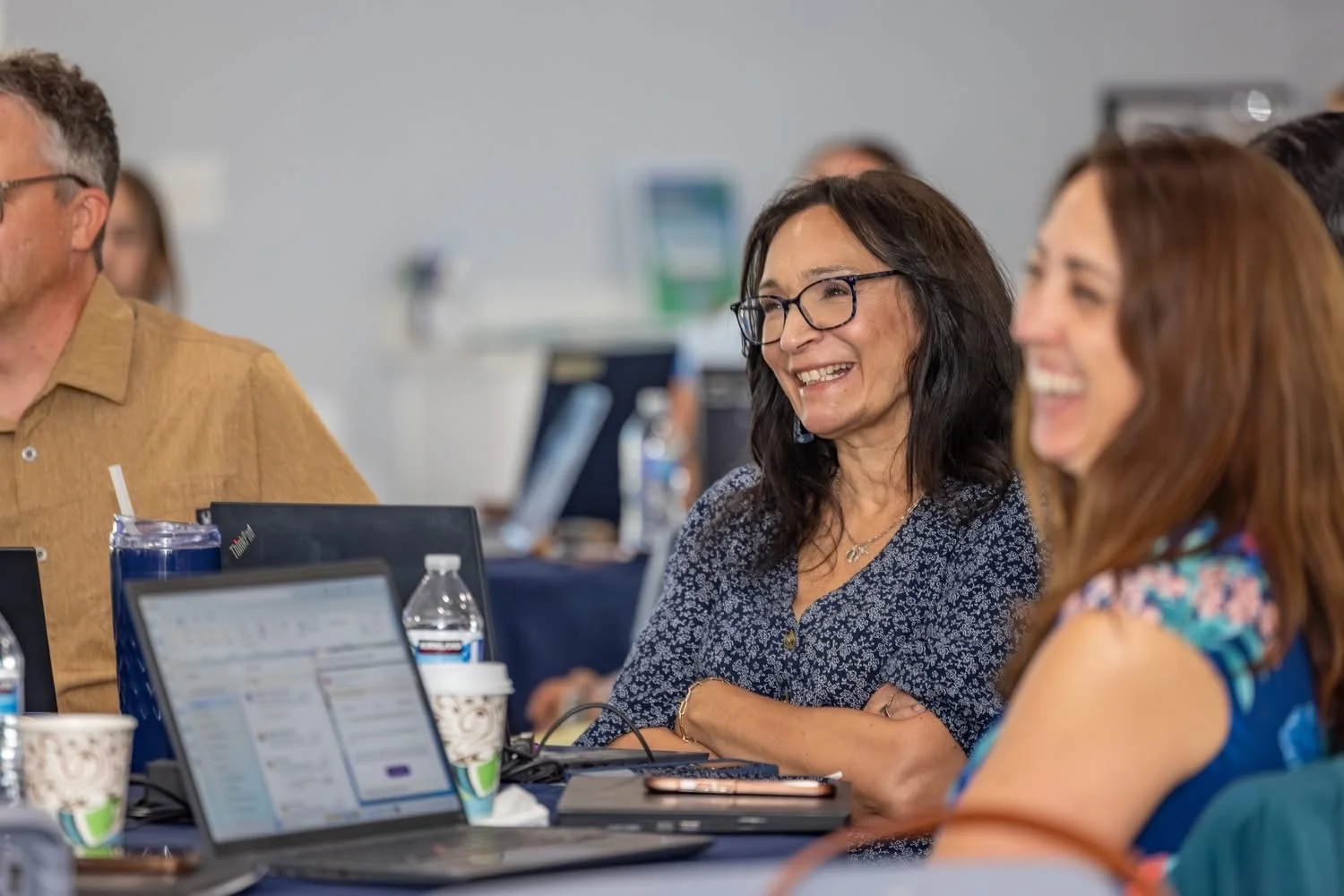 Workshop attendees laughing together